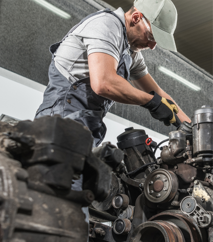 Mechanic working on a diesel engine